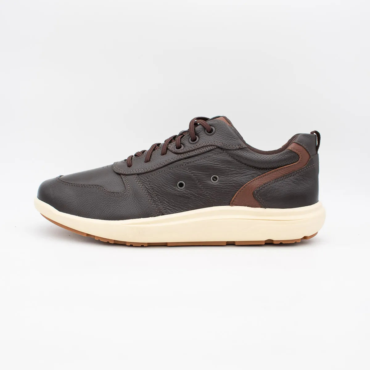 Dark gray sneaker with brown accents on a light gray background