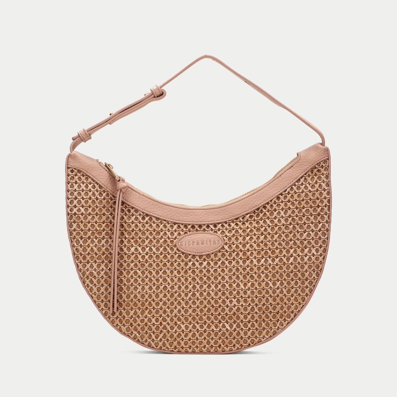 Patterned handbag with a pink strap on a white background