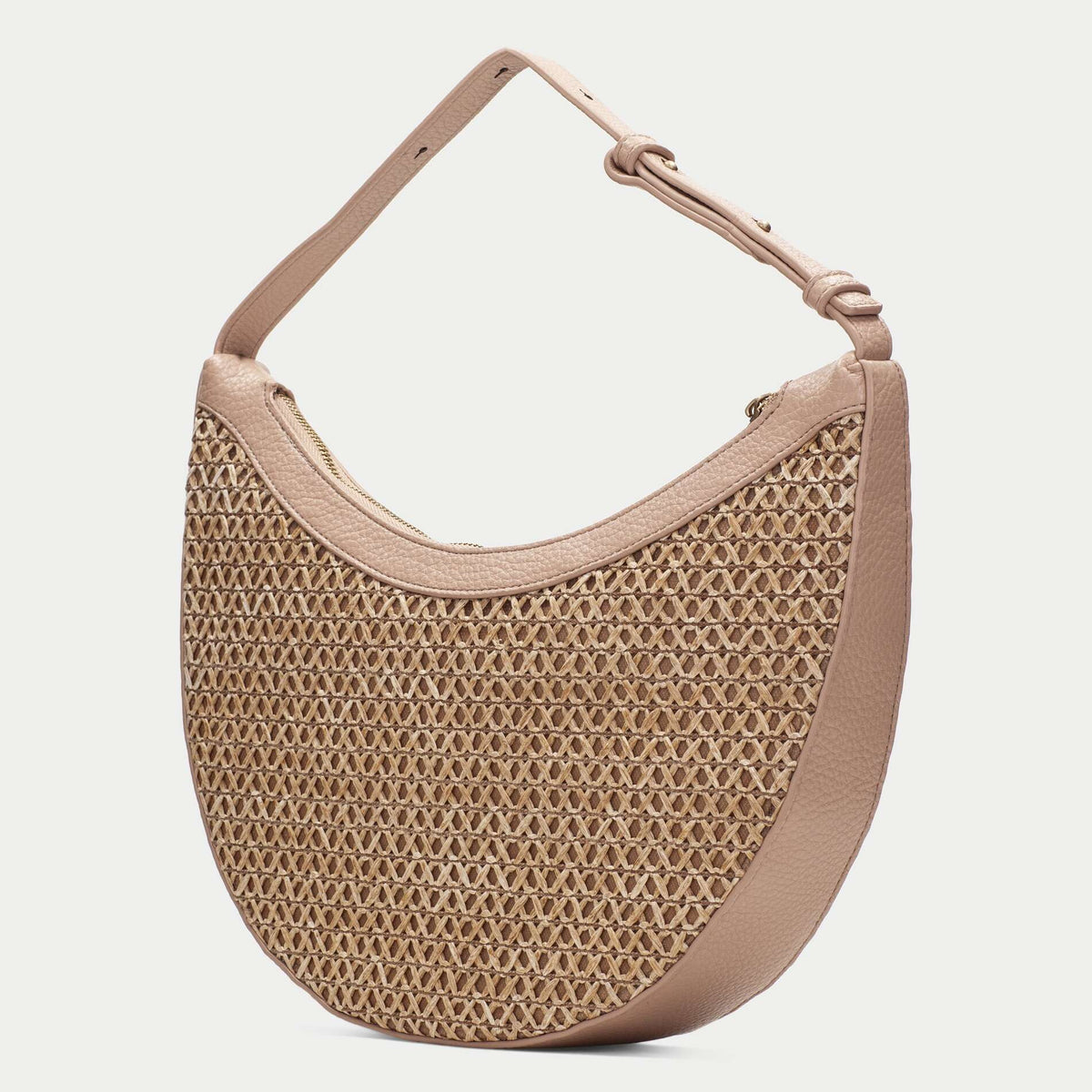 Beige woven handbag with a matching strap on a white background