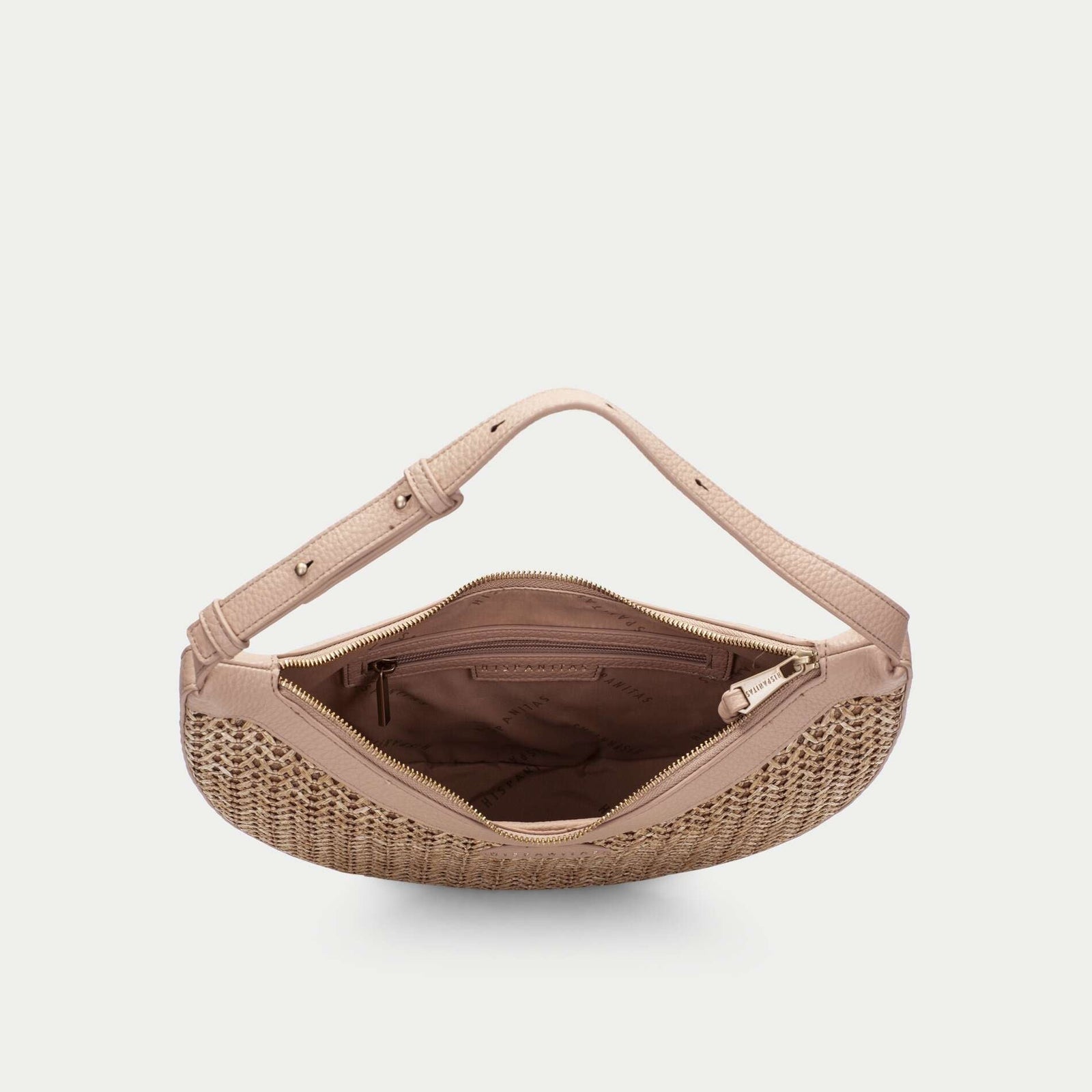 Beige woven handbag on a light beige background