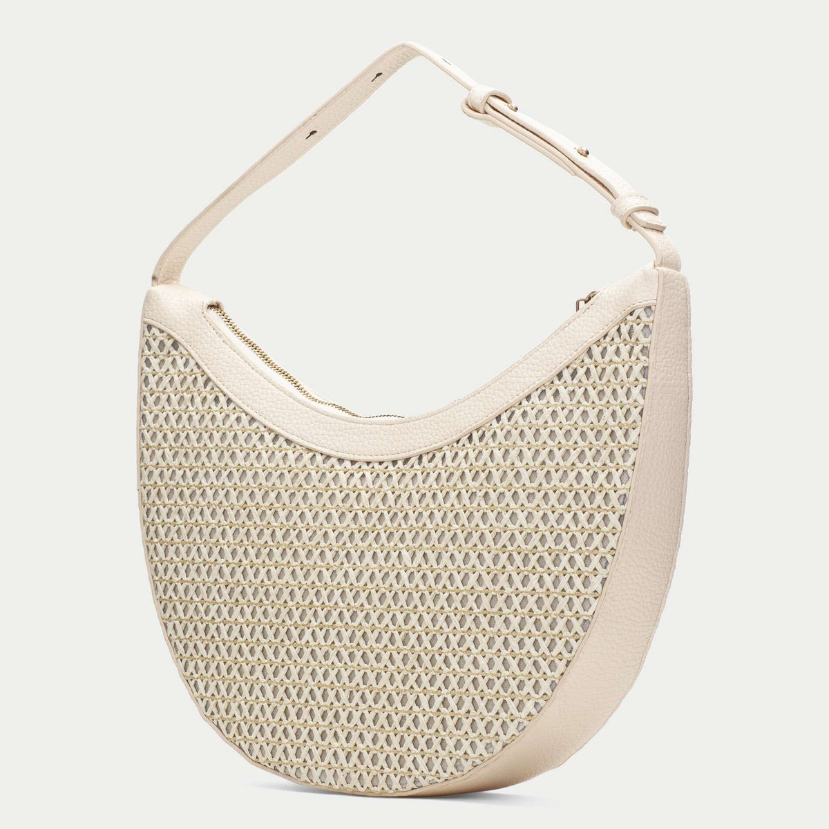 Beige woven handbag on a white background
