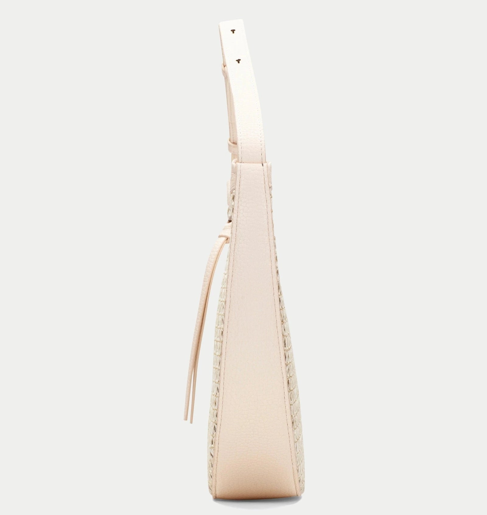Beige handbag with a strap on a light gray background