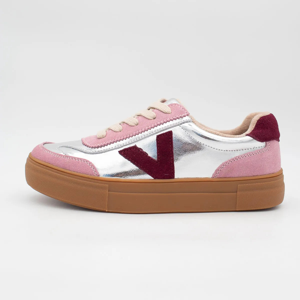 Sneaker with pink and white design on a light gray background