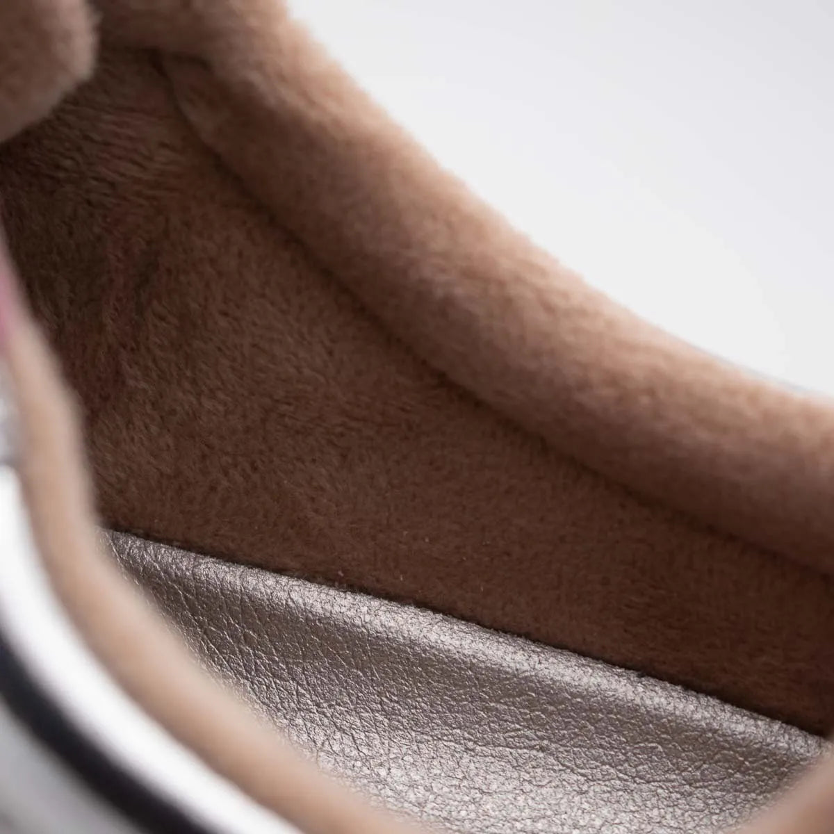 Close-up of brown leather texture with a blurred background