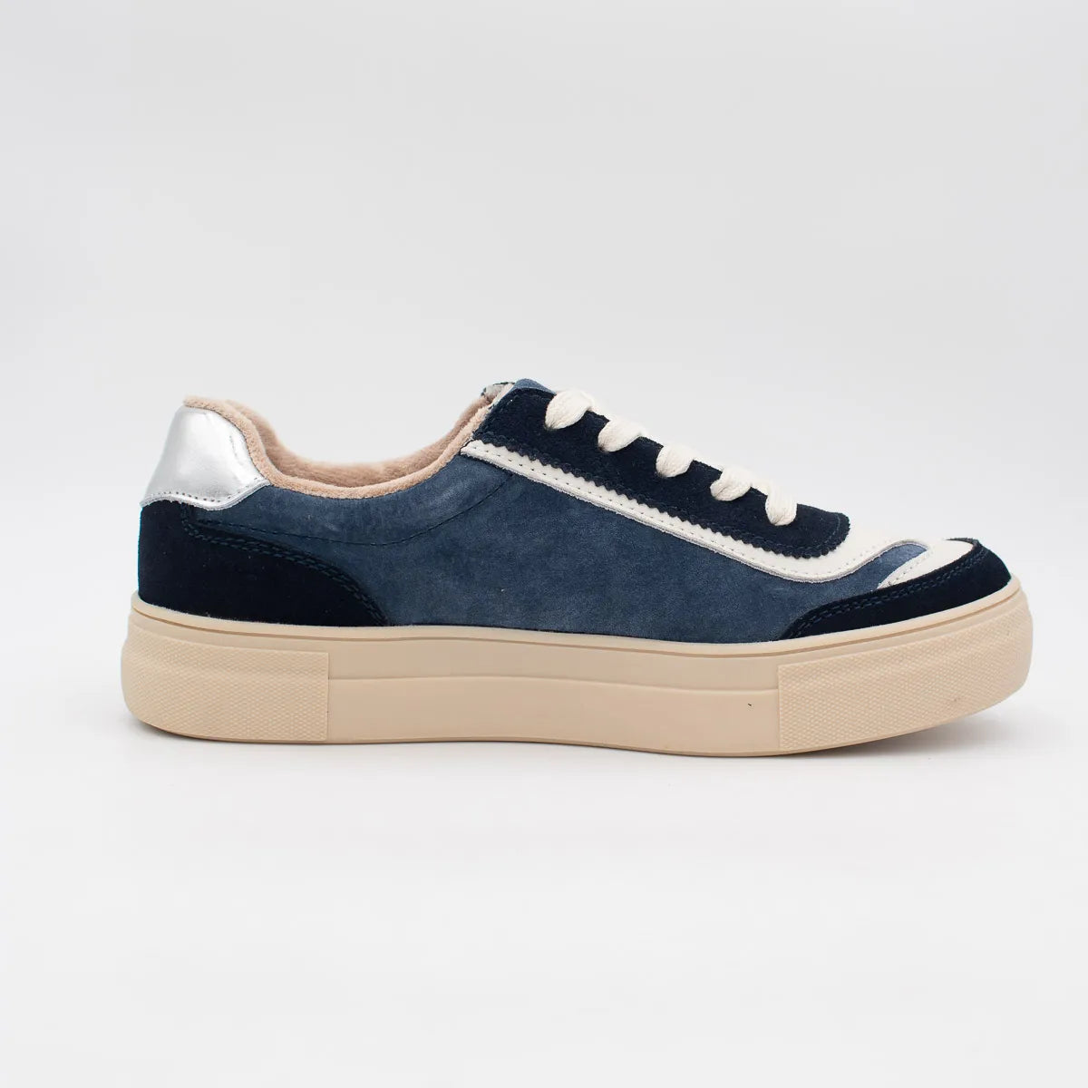 Navy blue sneaker with beige sole on a white background
