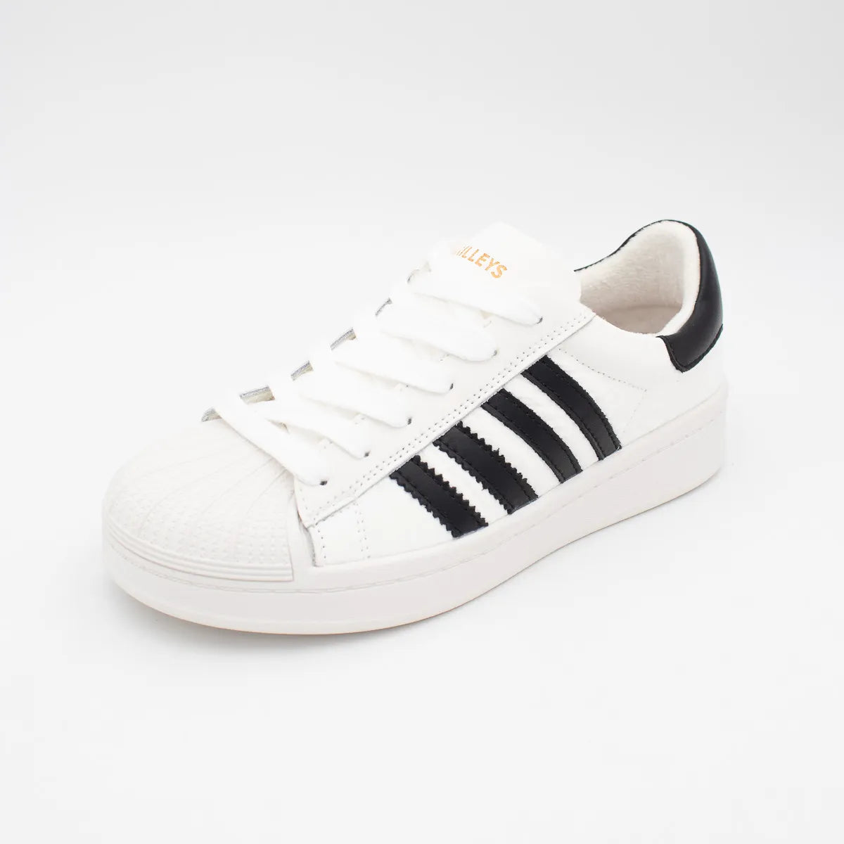 White sneaker with black stripes on a white background