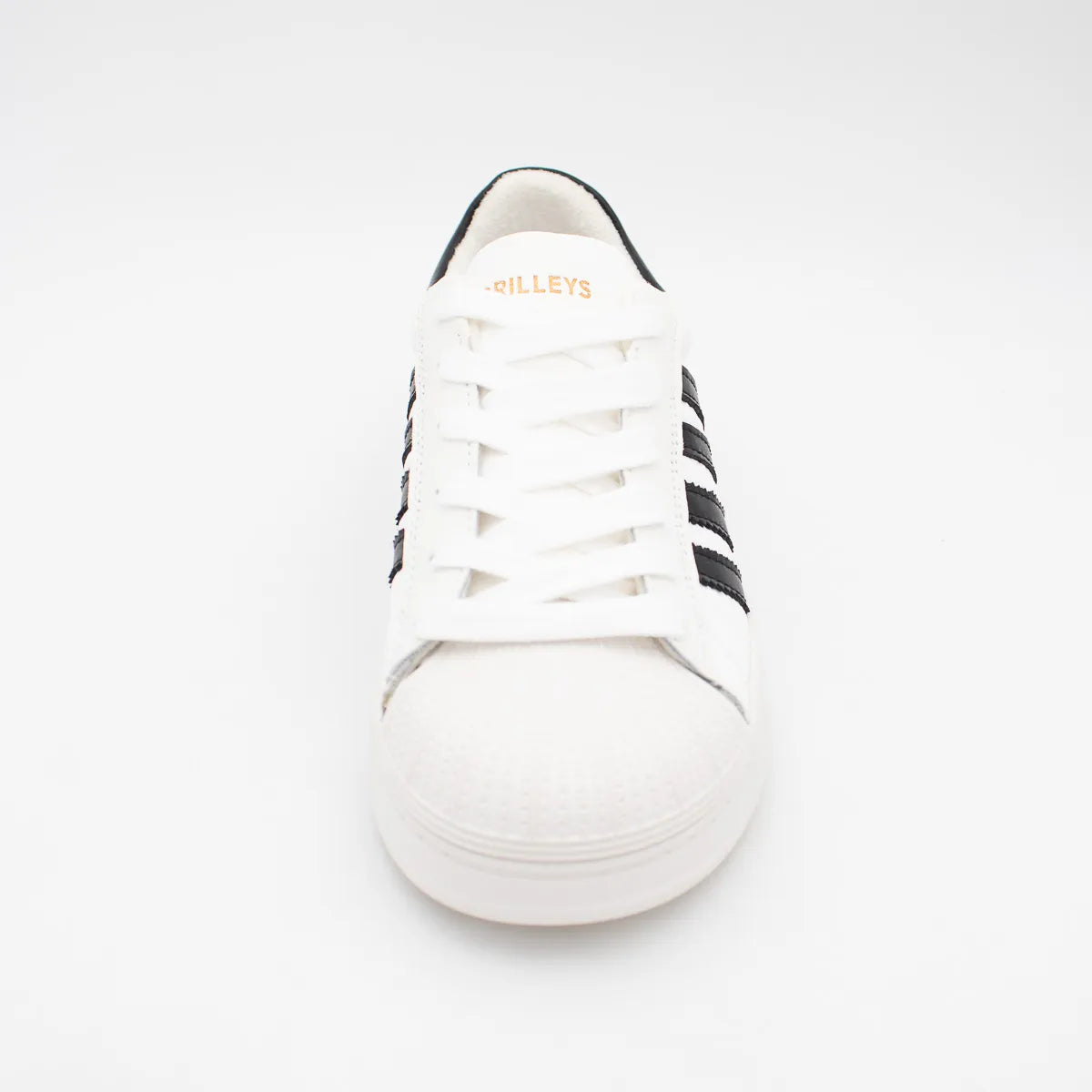 White sneaker with black stripes on a white background