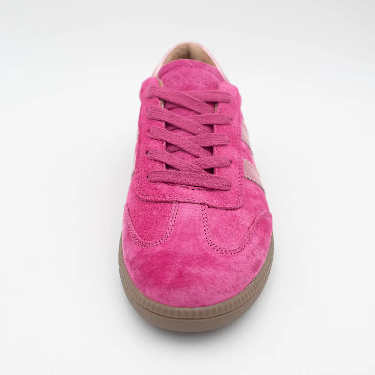 Pink sneaker with a brown sole on a white background