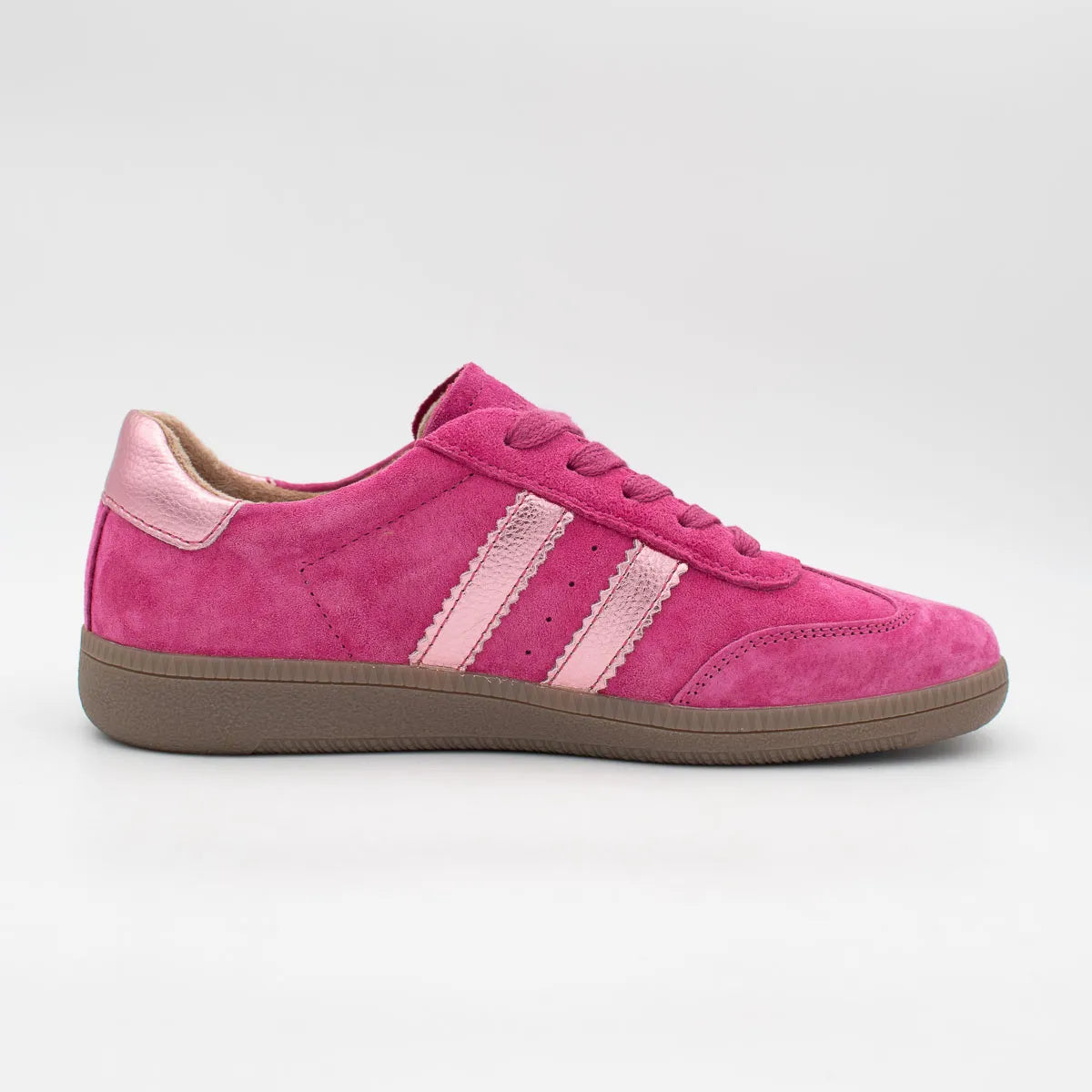 Pink sneaker with three white stripes on a light gray background
