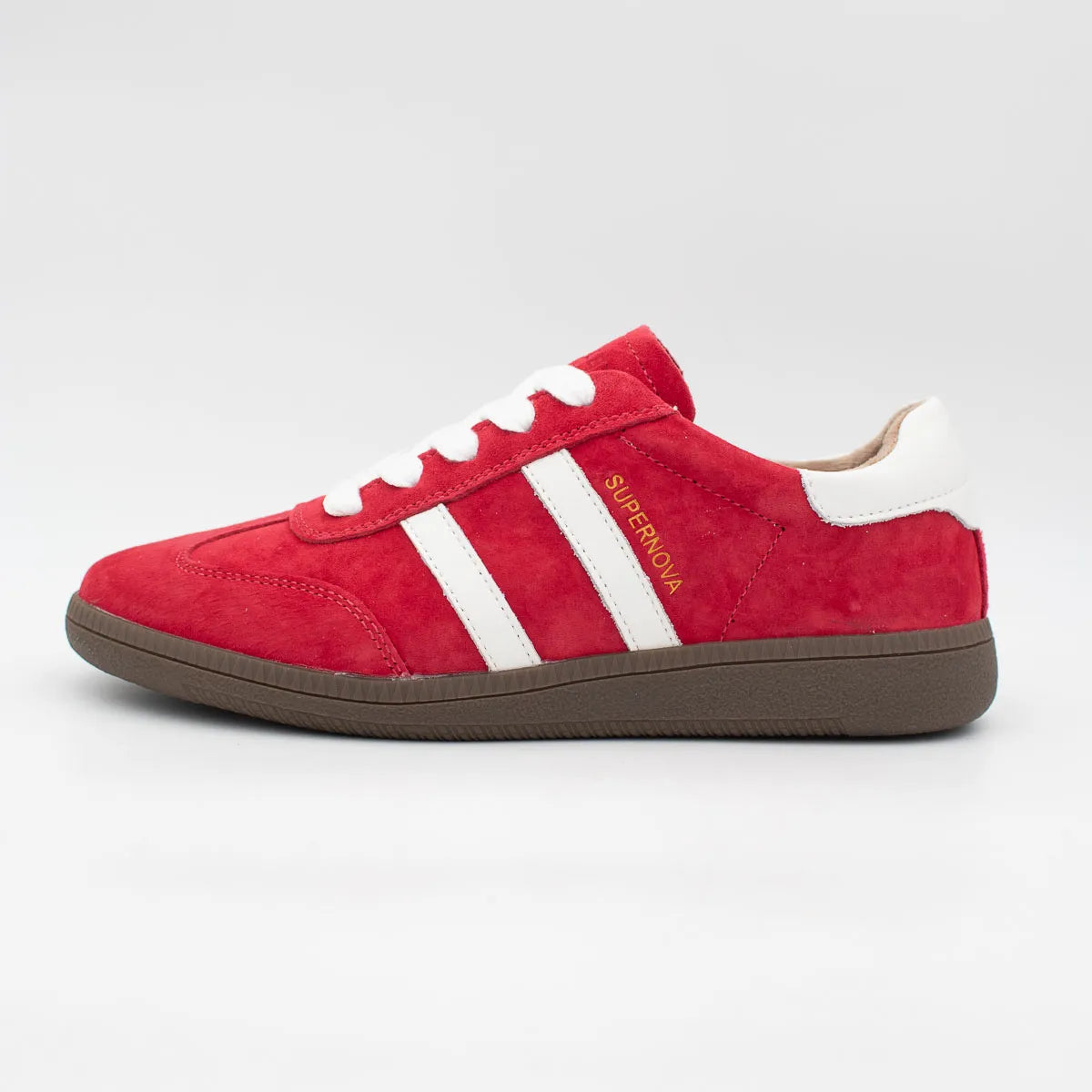 Red sneaker with white stripes on a gray background