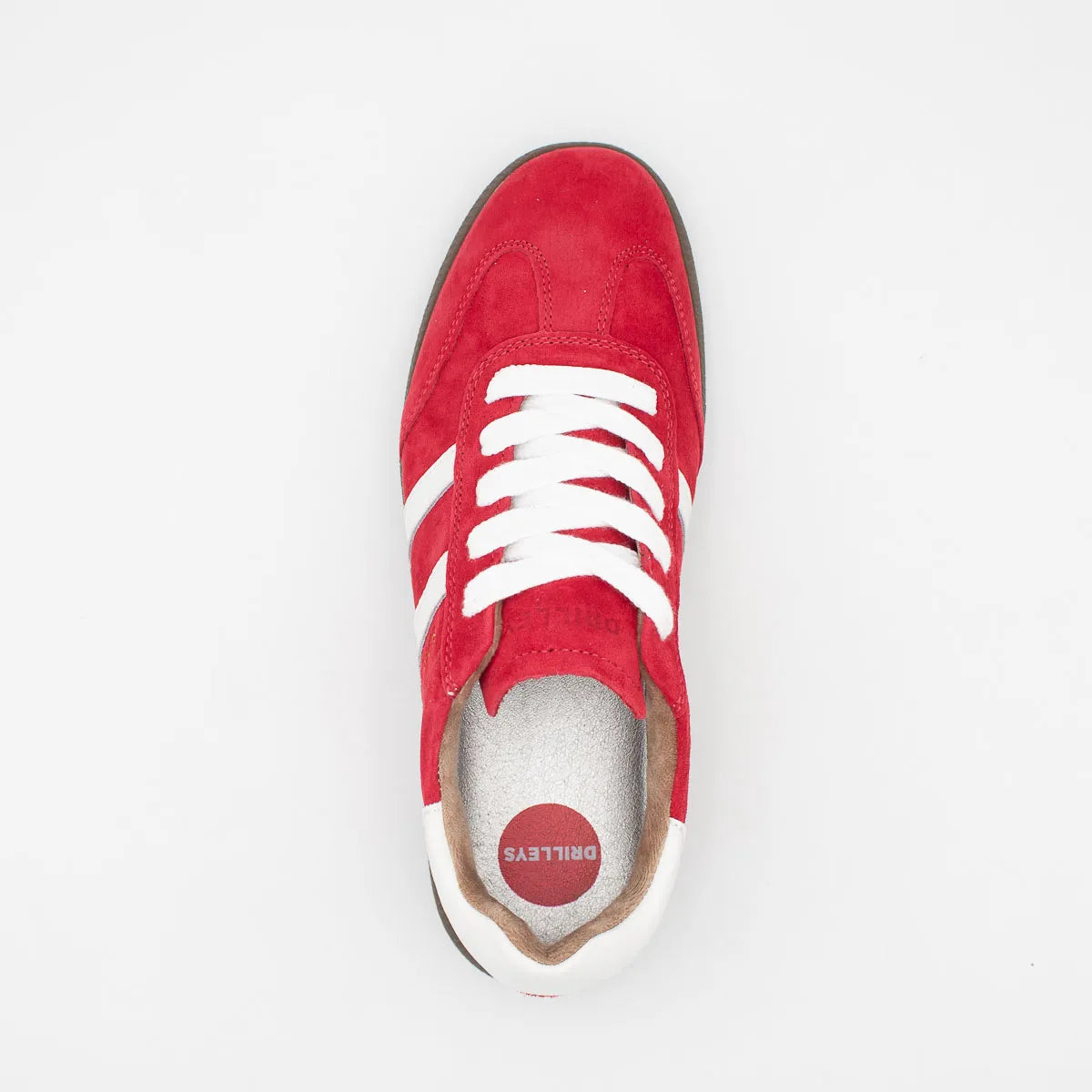 Red sneaker with white laces on a light gray background