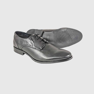 Image focusing on the sleek, block-heeled sole of the Dubarry Drago Black shoe.