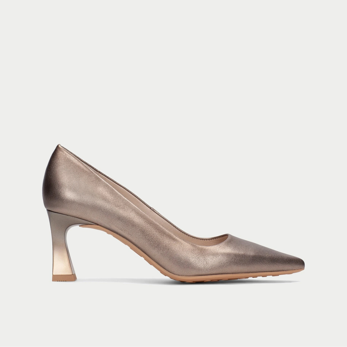 Bronze high-heeled shoe on a light gray background