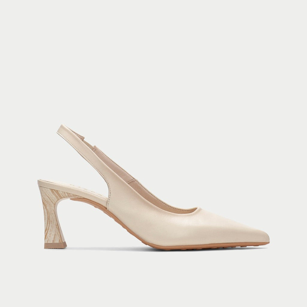 Beige slingback shoe on a light gray background