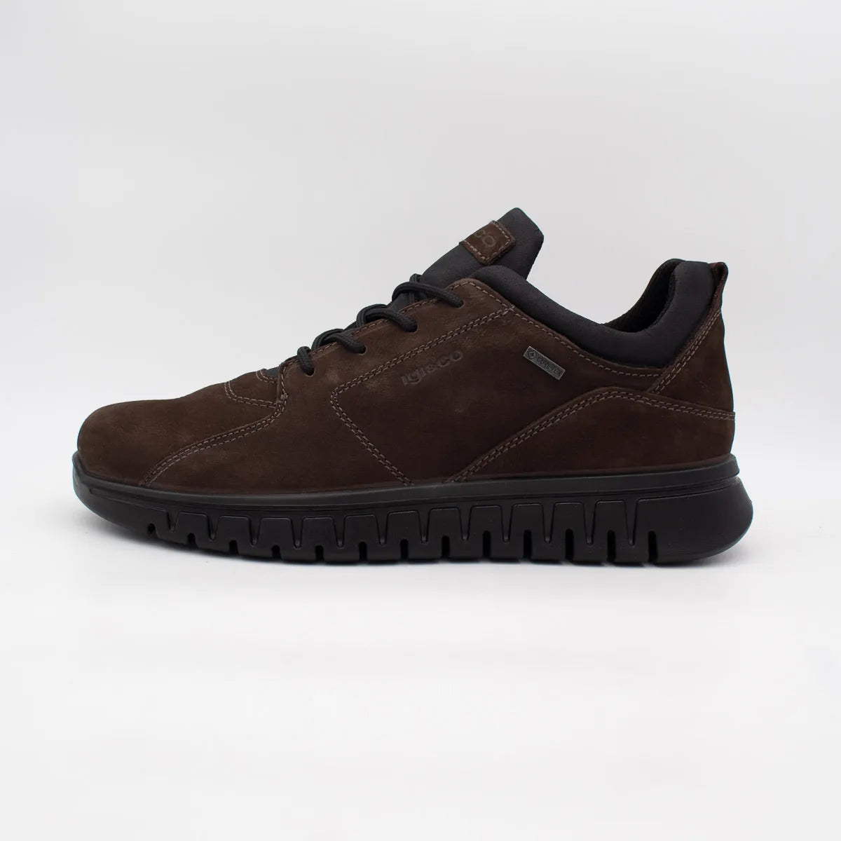 Brown leather shoe with black sole on a white background