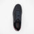 Black sneaker with visible brand logo on a white background