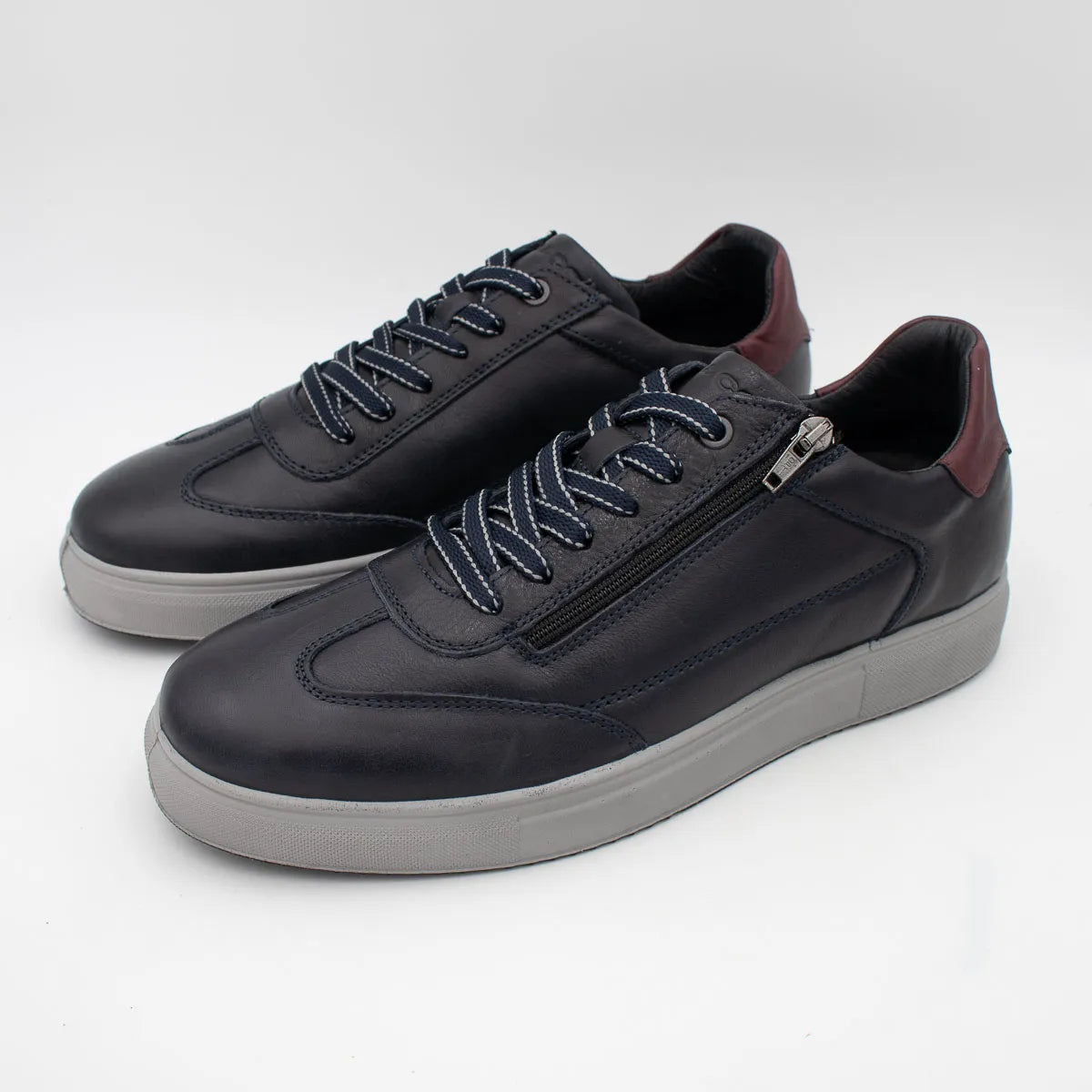 Black sneakers with a zipper on a white background