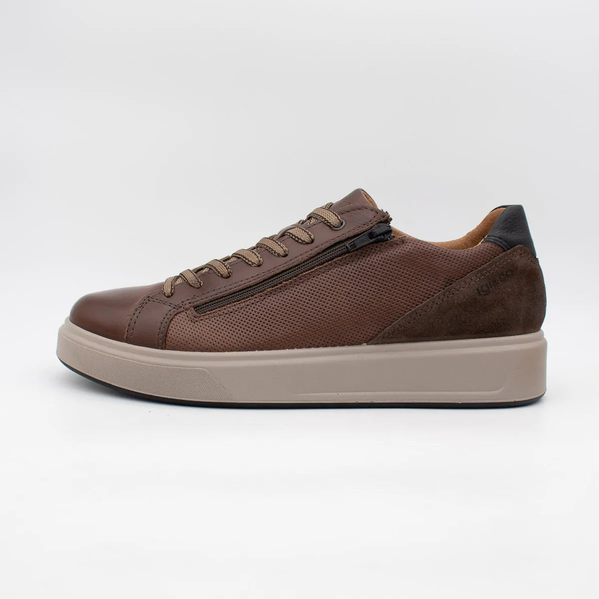 Brown leather sneaker with a zipper on a white background