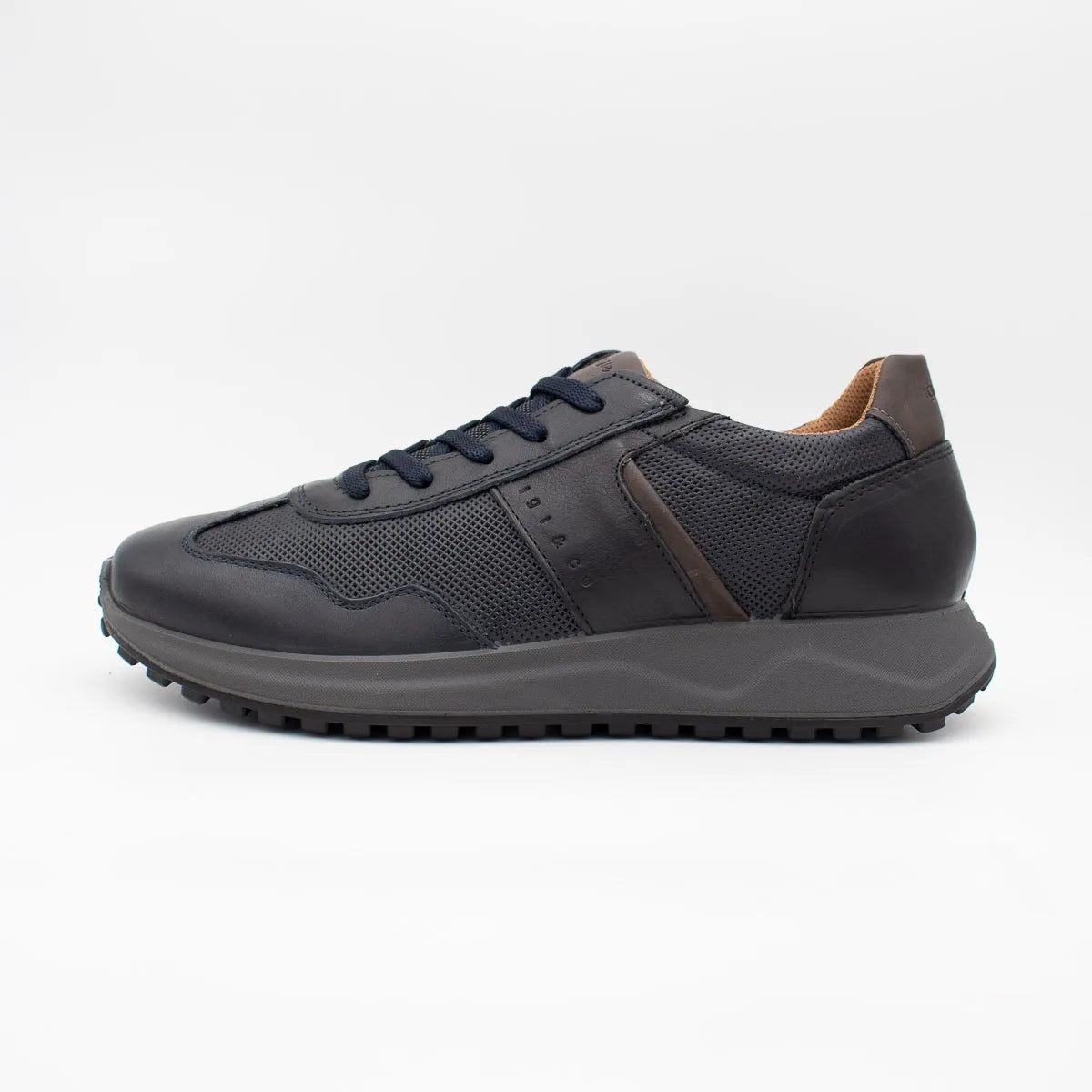 Dark gray sneaker with brown accents on a white background