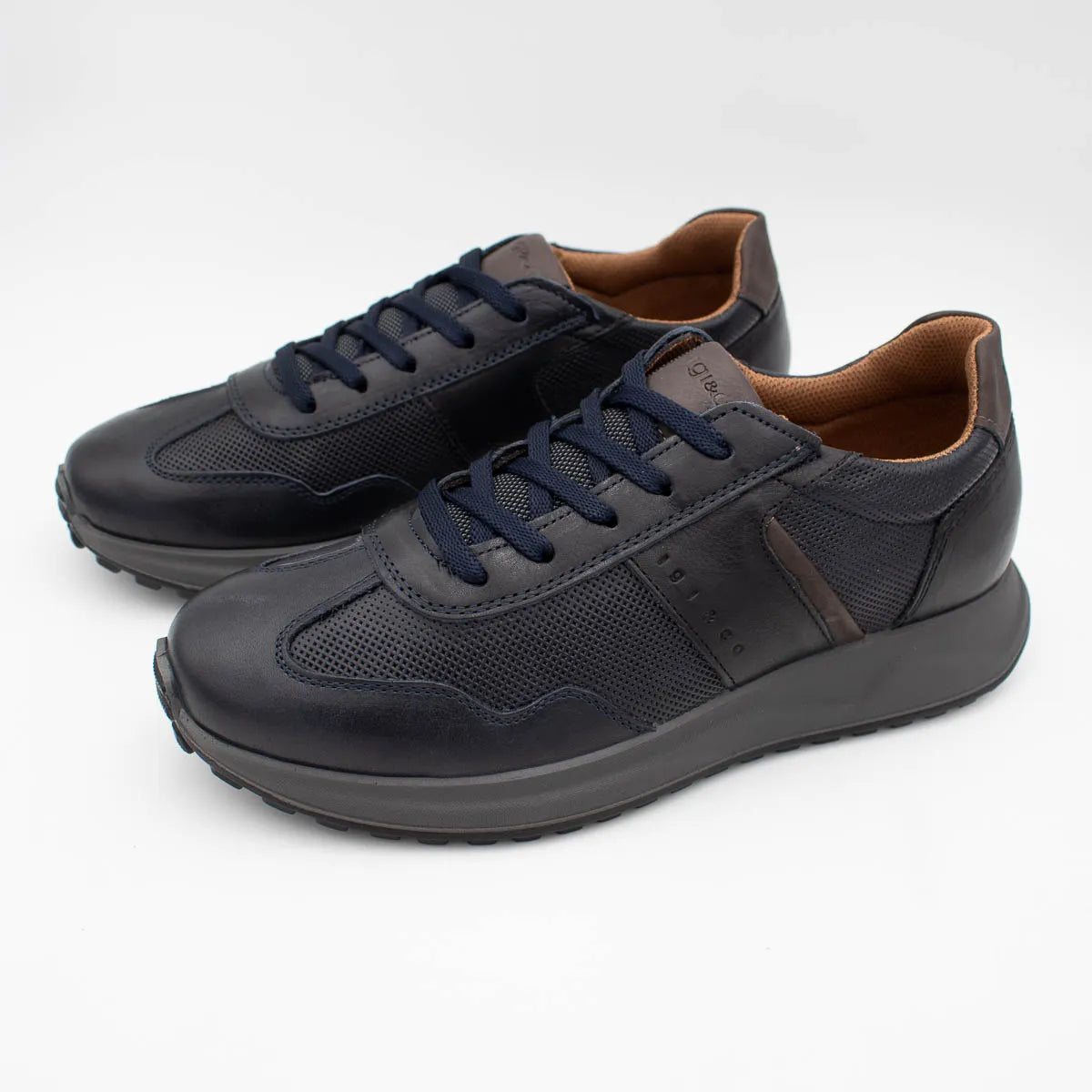 Pair of dark blue sneakers on a white background