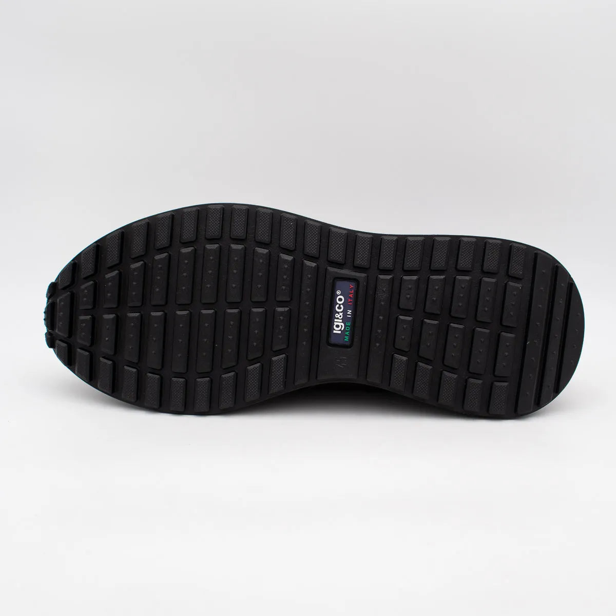 Black sole of a shoe with a visible brand logo on a white background