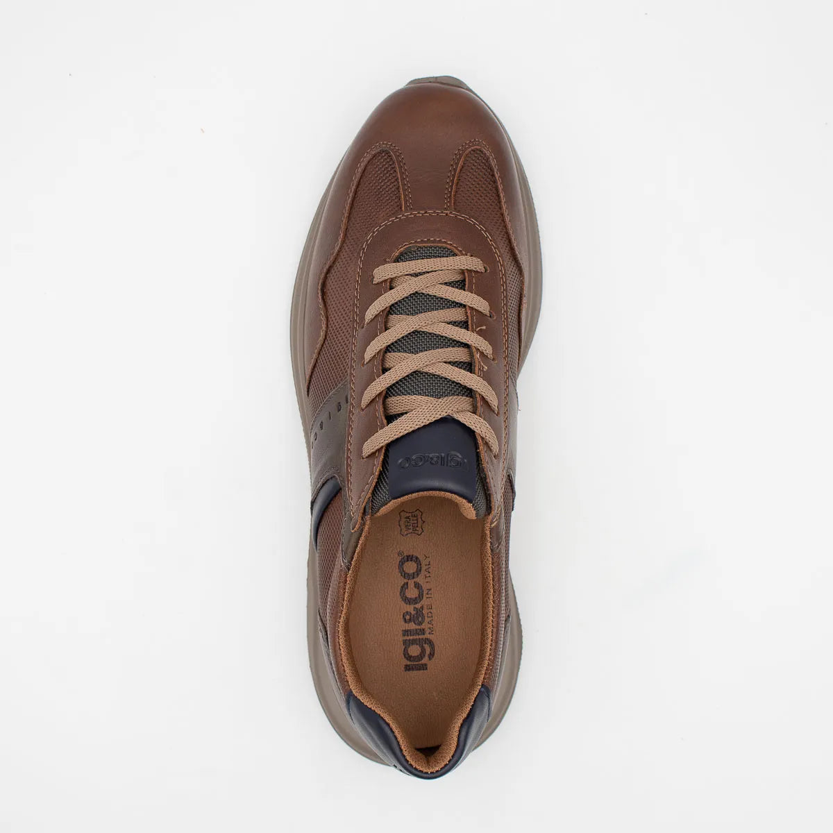 Brown sneaker with visible brand logo on a white background