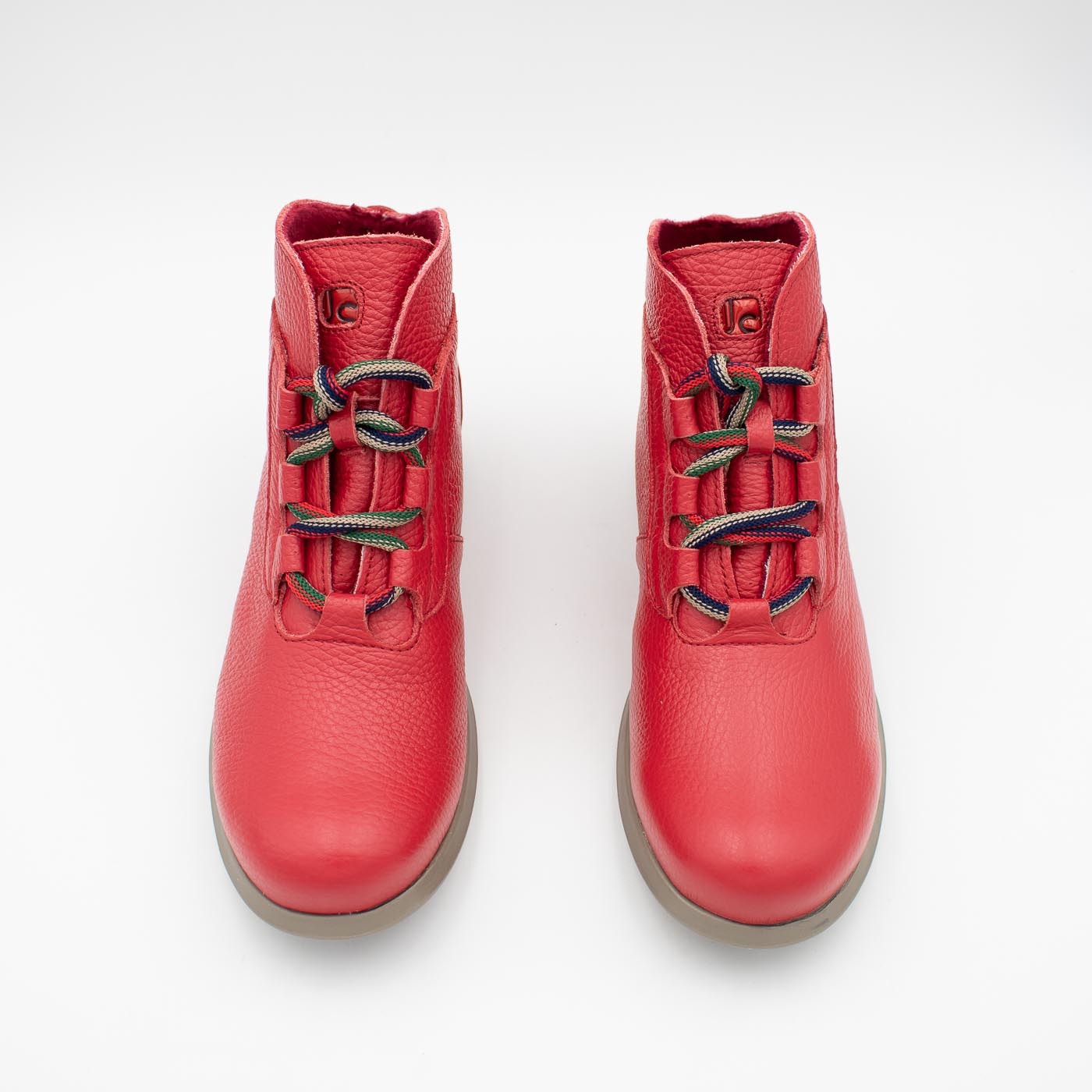 Frontal perspective of red ankle boot.