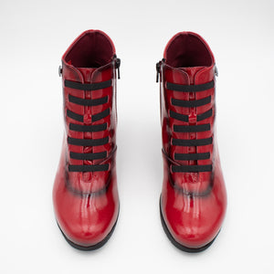 Frontal view of Jose Saenz's lustrous red patent ankle boot.