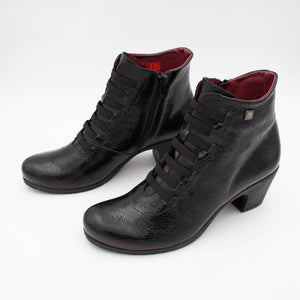 Stylish angled perspective of the sleek ankle boot pair.