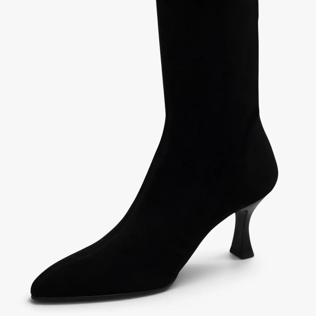 Close-up of the pointed toe and black suede-effect stretch upper on the Miss Elastic Zeta boot.