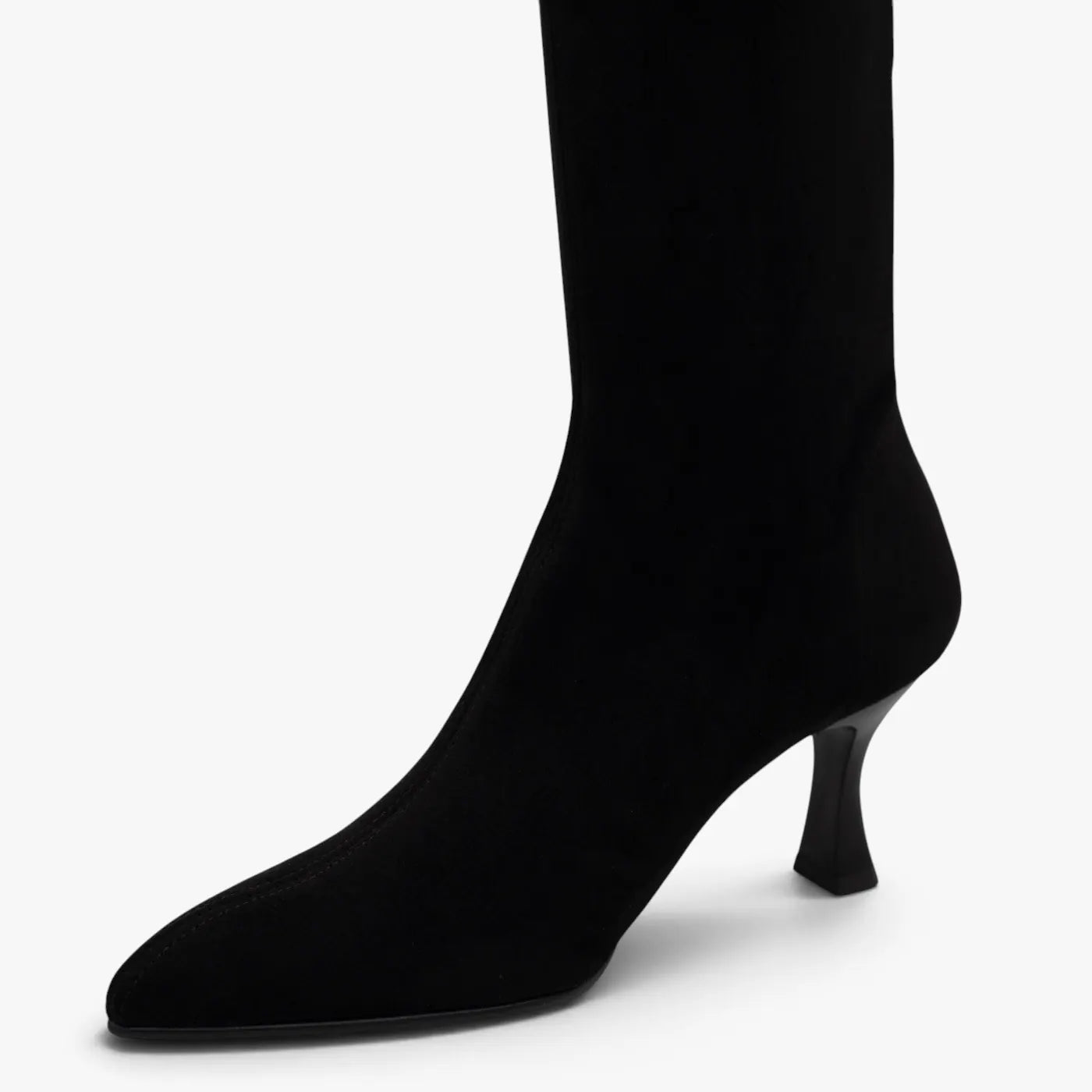 Close-up of the pointed toe and black suede-effect stretch upper on the Miss Elastic Zeta boot.