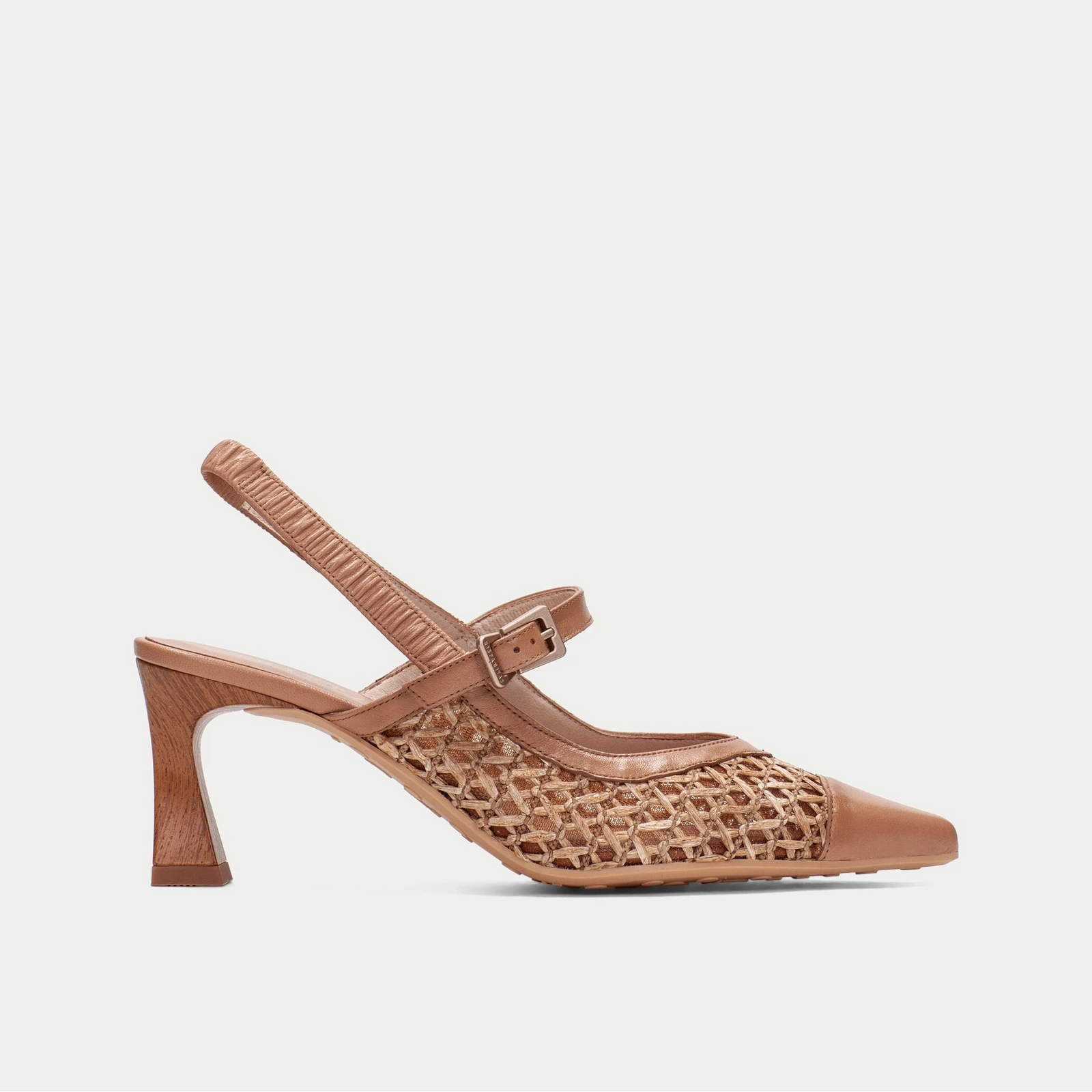 Brown sandal with mesh design on a light gray background