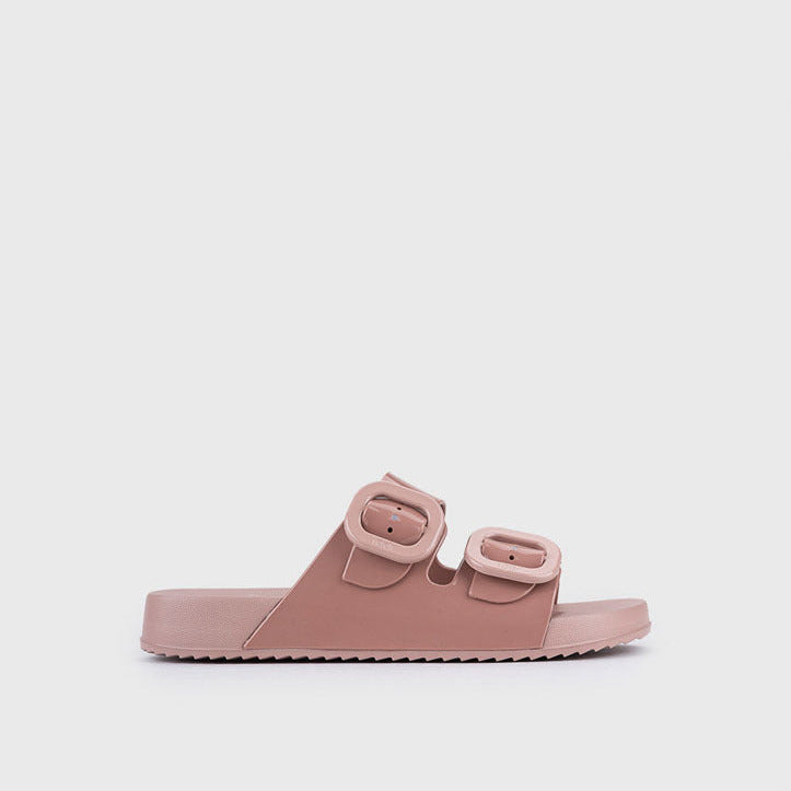 Pink sandal with double straps on a white background