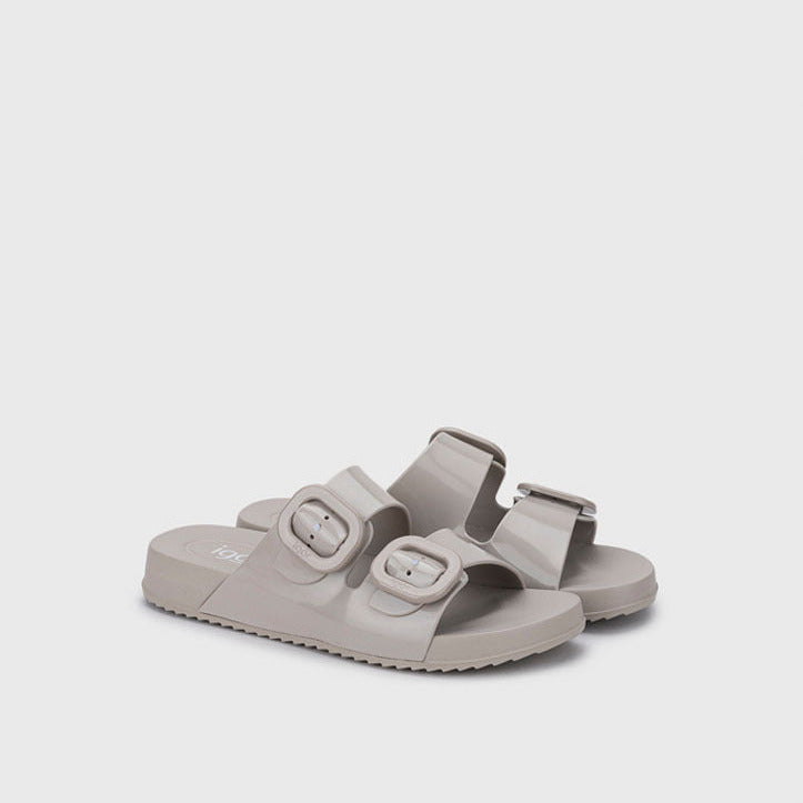 Pair of light gray sandals on a white background