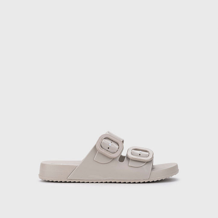 Beige sandal with double straps on a light gray background