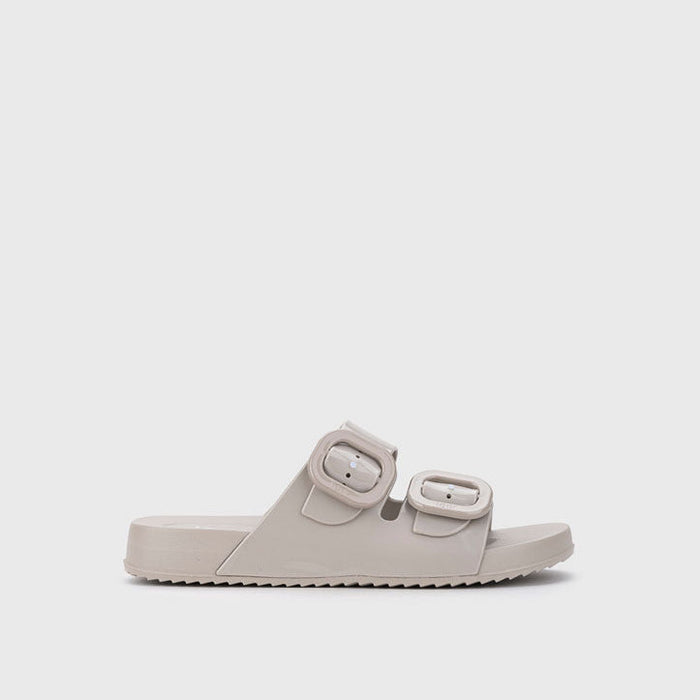 Beige sandal with double straps on a light gray background
