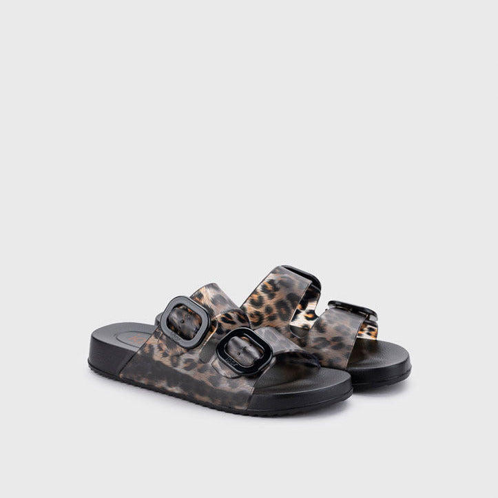 Pair of sandals with leopard print straps on a light gray background