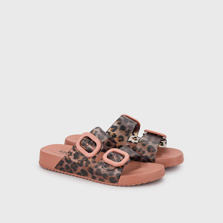 Leopard print sandals with pink straps on a light gray background