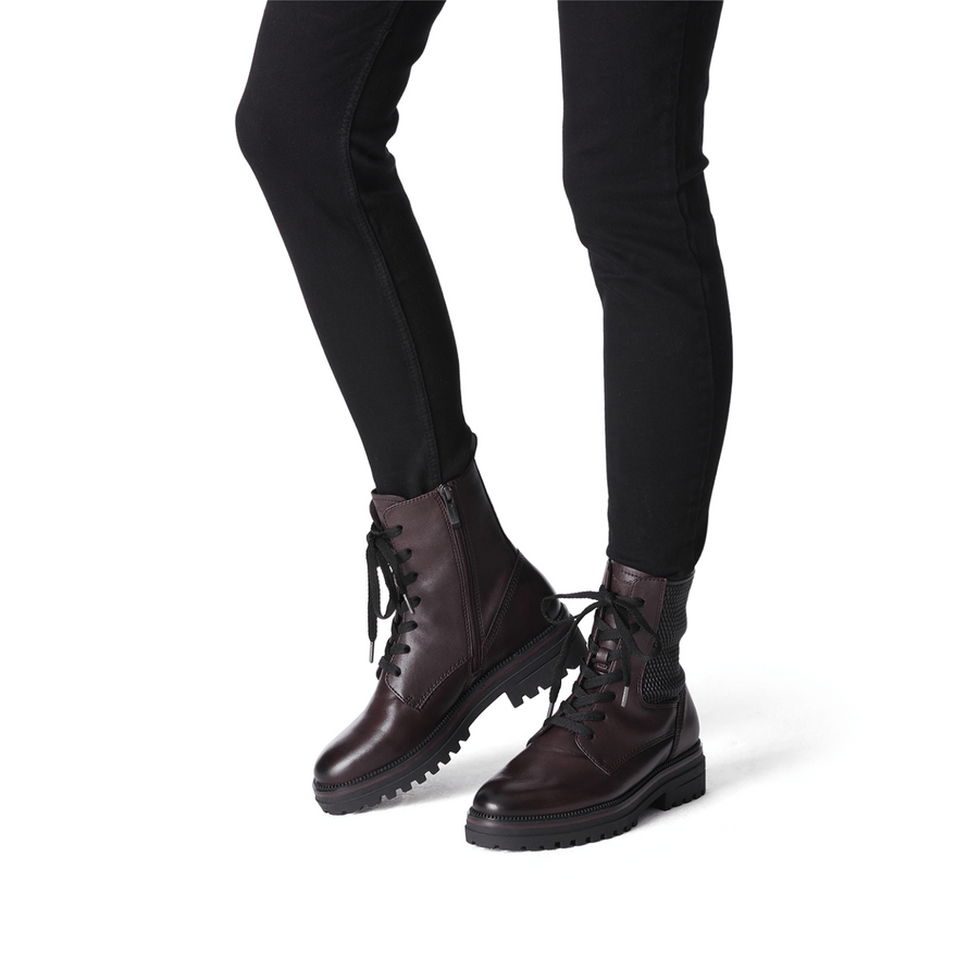 Woman wearing Tamaris Bordeaux Ankle Boot with black jeans.