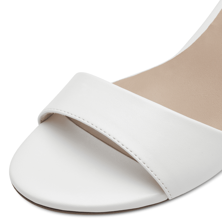  Full view of Tamaris' elegant white occasionwear sandal, perfect for dressy events.