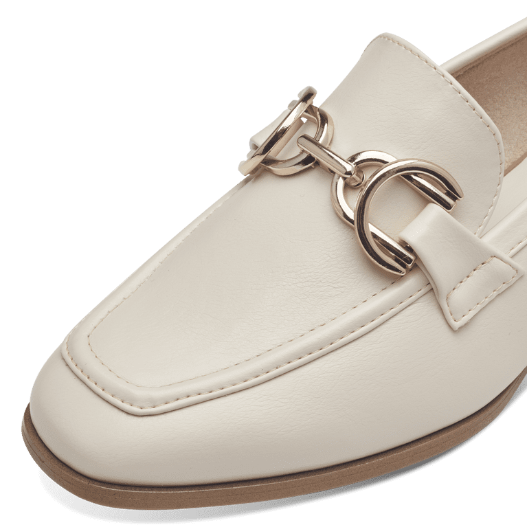 Close-up of the Marco Tozzi Cream Loafer's front, featuring the gold detail.
