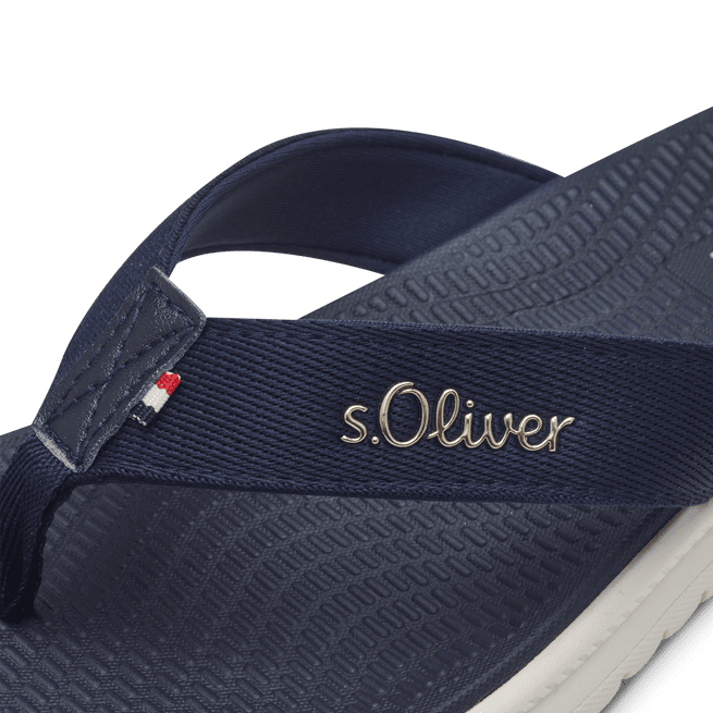 Close-up view of the S Oliver navy sandal's toe bar and strap logo.
