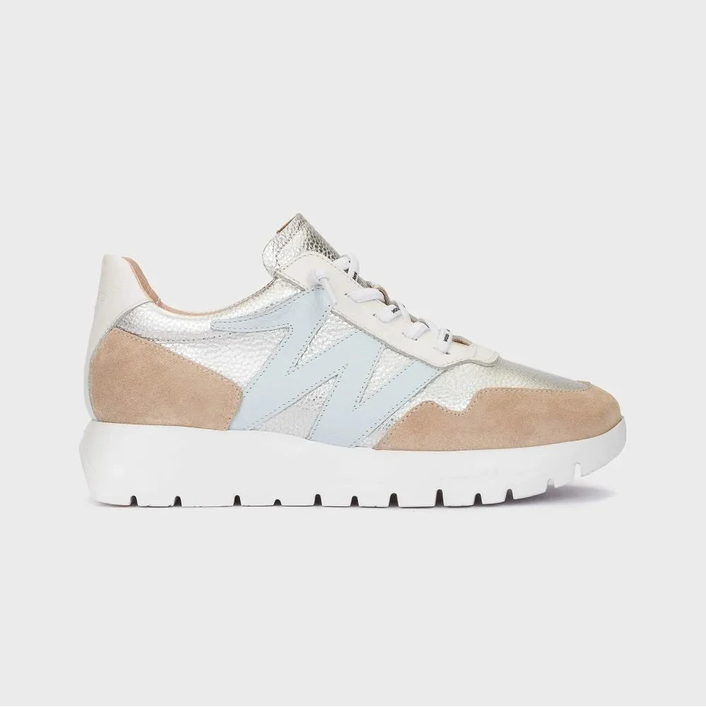 Two-tone sneaker with beige and light blue design on a white background