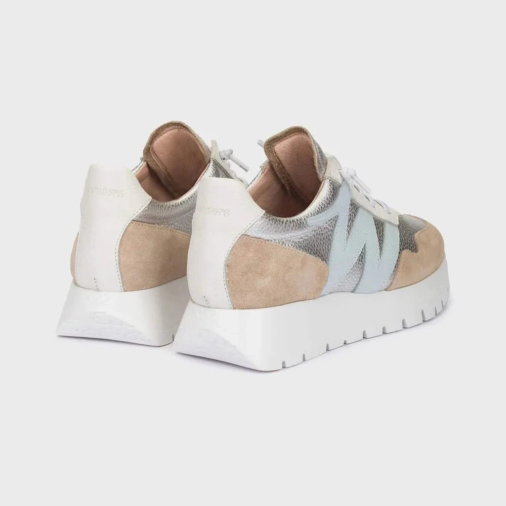 Pair of white and beige sneakers on a light gray background
