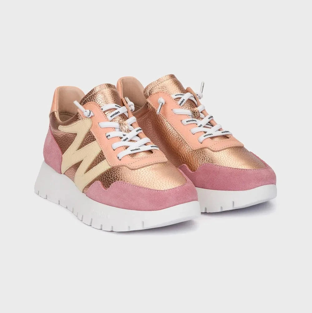 Pair of pink and rose gold sneakers on a light gray background