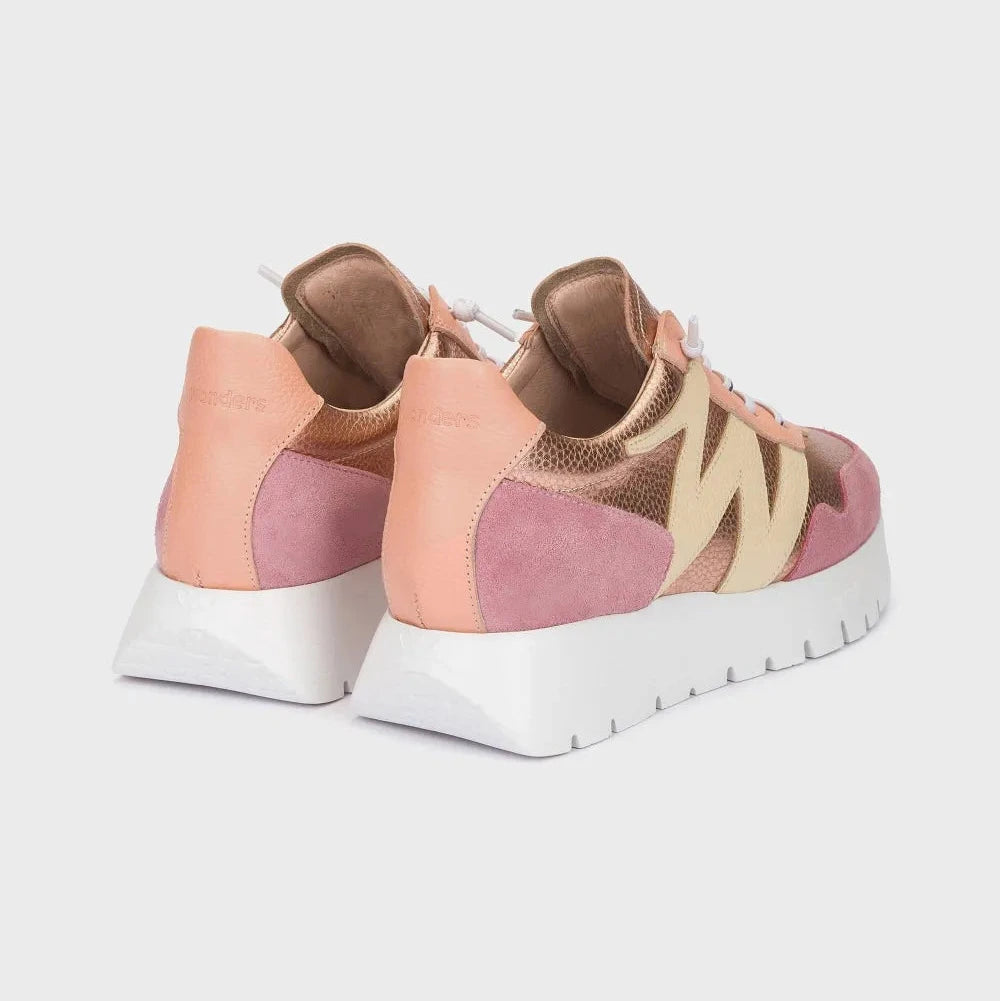 Pair of multicolored sneakers on a light gray background