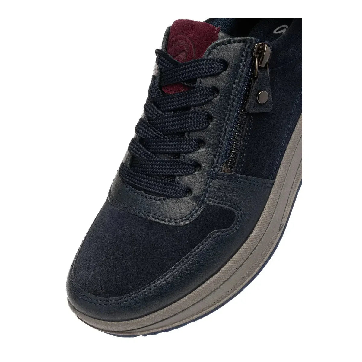 Close-up of the laces, side zip and navy suede on an Ara Sapporo trainer.