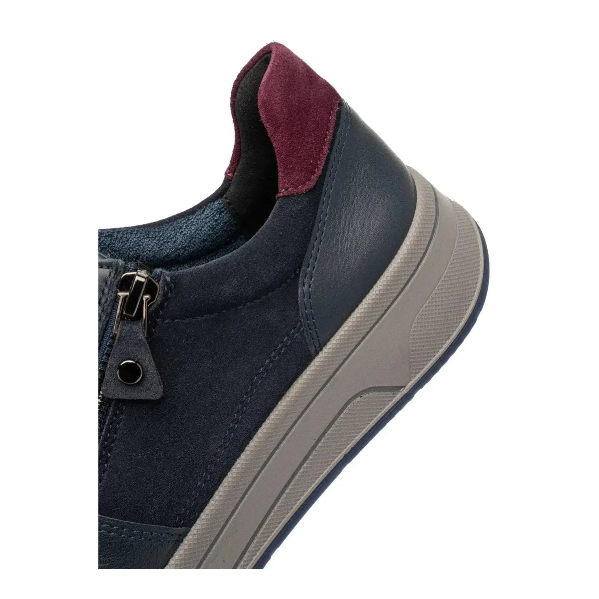 Close-up of the merlot heel panel and taupe sole on the Ara Sapporo trainer.