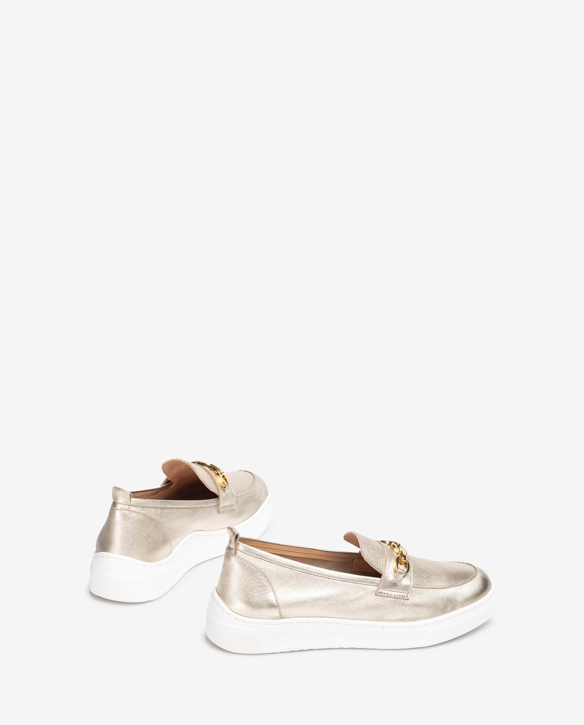 Side view showing the sporty white rubber sole of the Unisa FINDAY Metallic Loafer.
