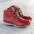 Red ankle boots by Jose Saenz outdoors.